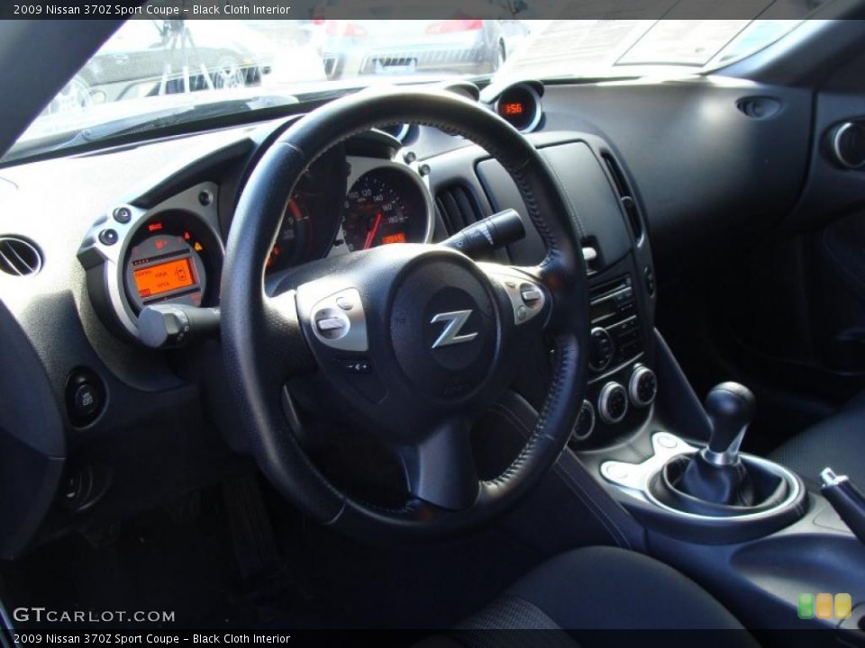Black Cloth Interior Dashboard for the 2009 Nissan 370Z Sport Coupe #42510736