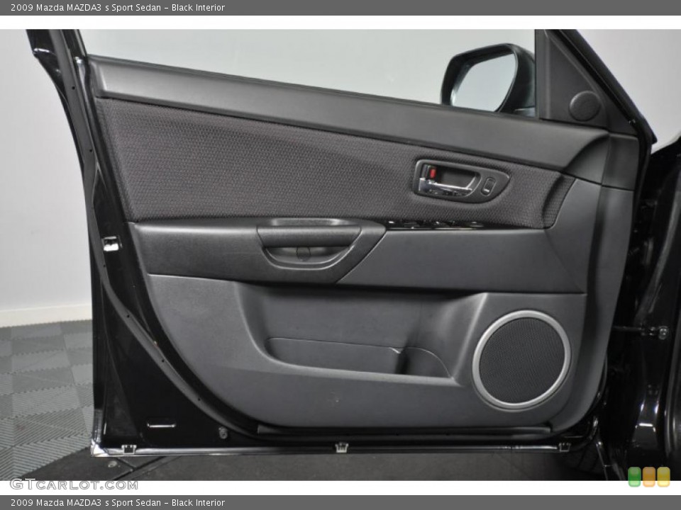 Black Interior Door Panel for the 2009 Mazda MAZDA3 s Sport Sedan #42579170