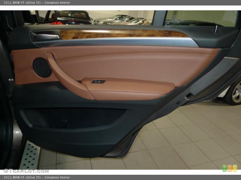Cinnamon Interior Door Panel for the 2011 BMW X5 xDrive 35i #42791657