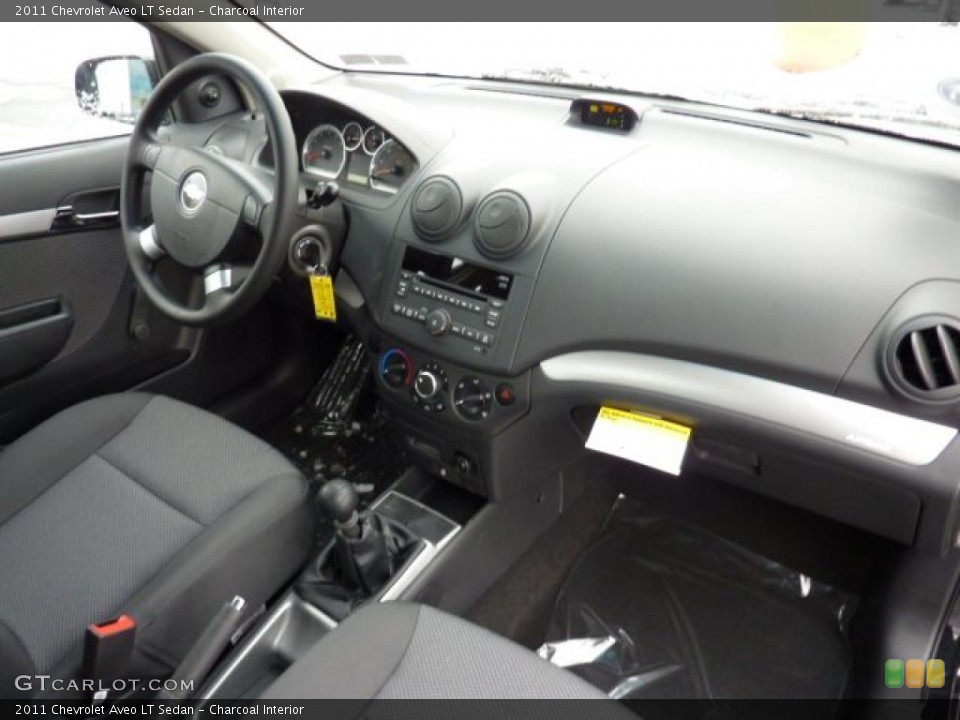 Charcoal Interior Dashboard for the 2011 Chevrolet Aveo LT Sedan #42960363