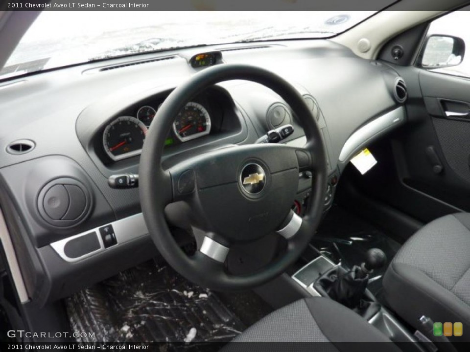 Charcoal Interior Dashboard for the 2011 Chevrolet Aveo LT Sedan #42960447