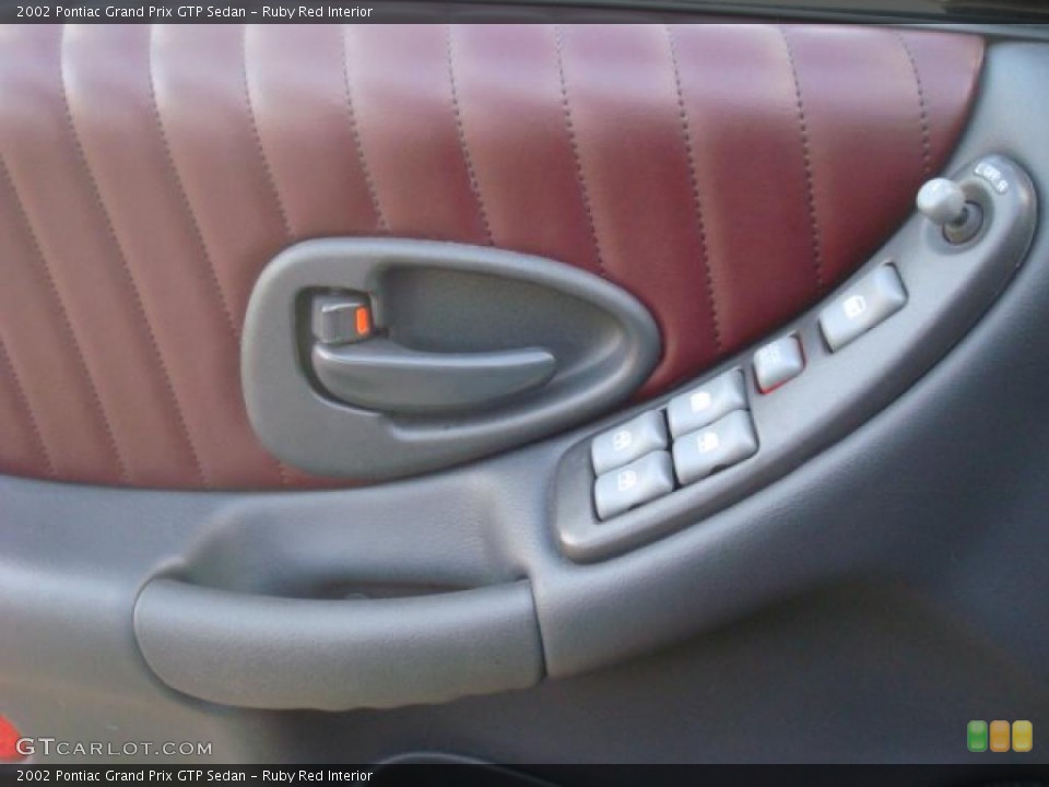 Ruby Red Interior Controls for the 2002 Pontiac Grand Prix GTP Sedan #42975281