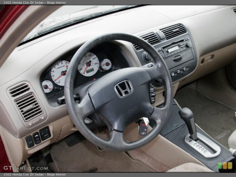 Beige Interior Dashboard for the 2002 Honda Civic EX Sedan #43101257