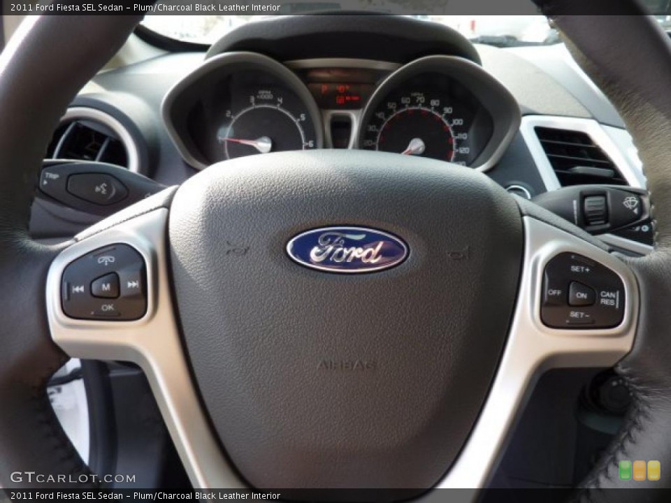 Plum/Charcoal Black Leather Interior Controls for the 2011 Ford Fiesta SEL Sedan #43261262