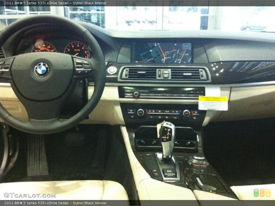 Oyster/Black Interior Dashboard for the 2011 BMW 5 Series 535i xDrive Sedan #43341791
