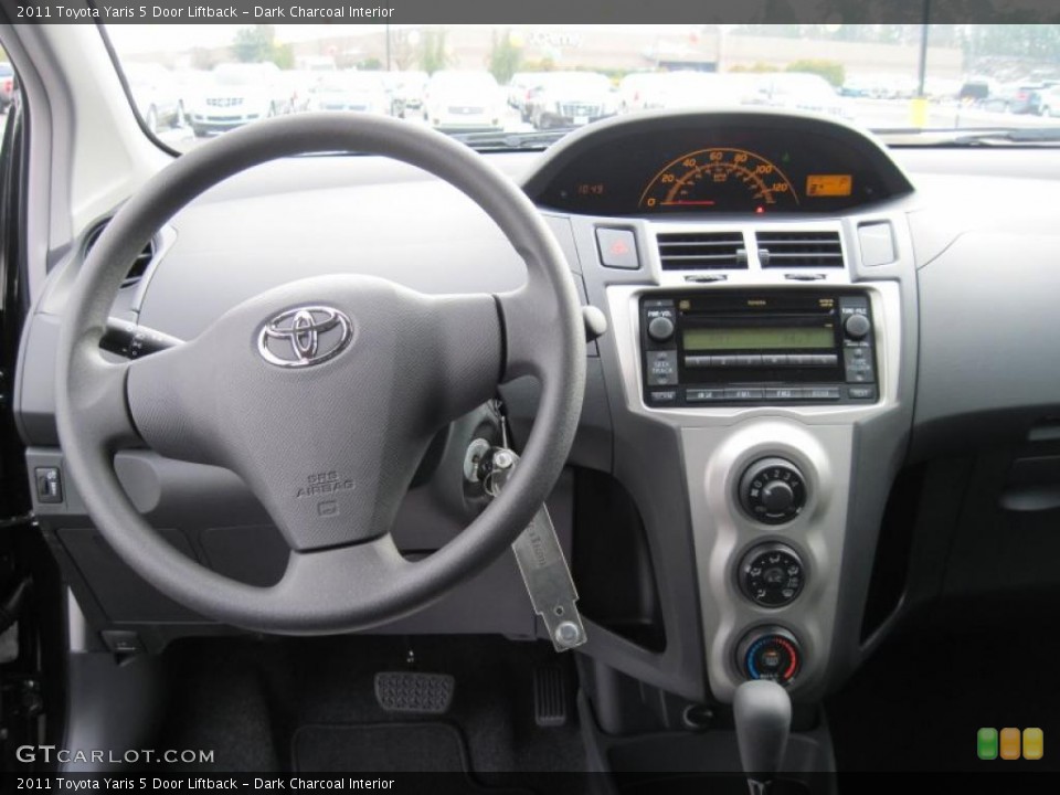 Dark Charcoal Interior Dashboard for the 2011 Toyota Yaris 5 Door Liftback #43362387