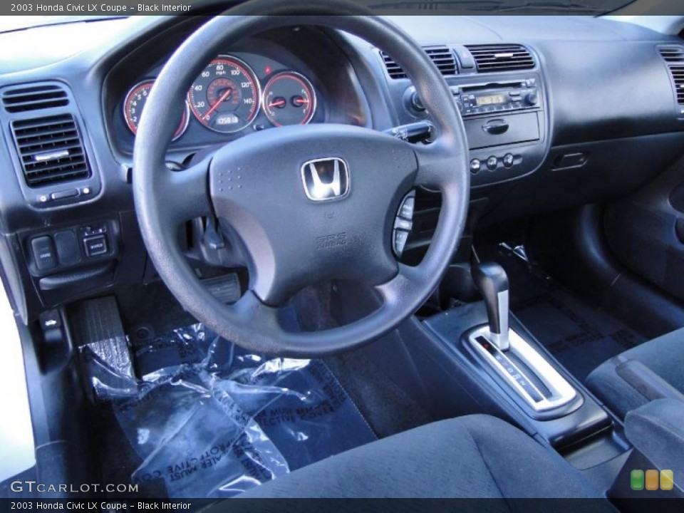 Black Interior Dashboard for the 2003 Honda Civic LX Coupe #43376061