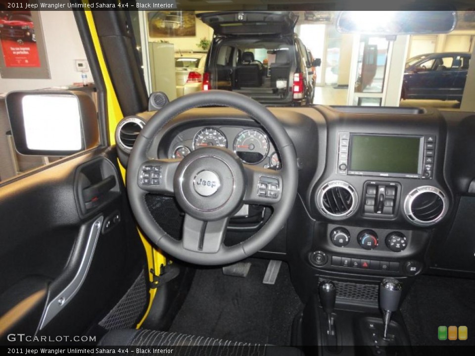 Black Interior Dashboard for the 2011 Jeep Wrangler Unlimited Sahara 4x4 #43388771