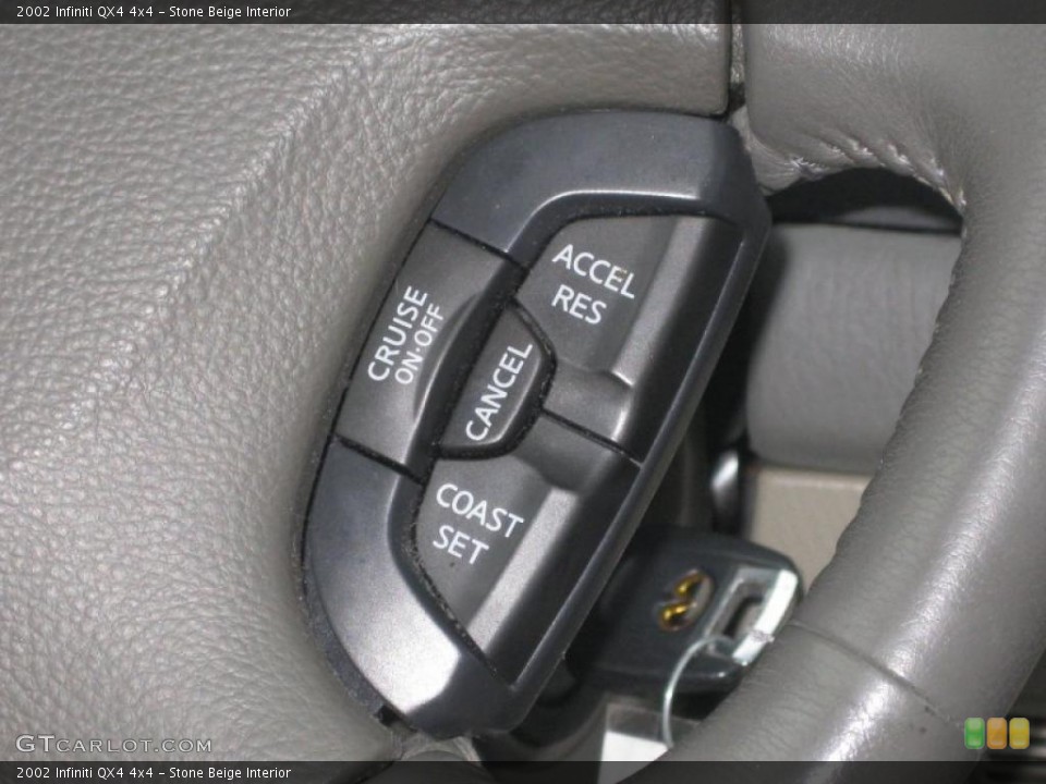 Stone Beige Interior Controls for the 2002 Infiniti QX4 4x4 #43497648