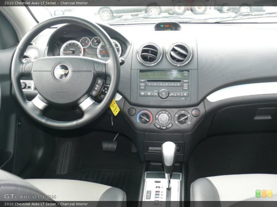 Charcoal Interior Dashboard for the 2010 Chevrolet Aveo LT Sedan #43523147