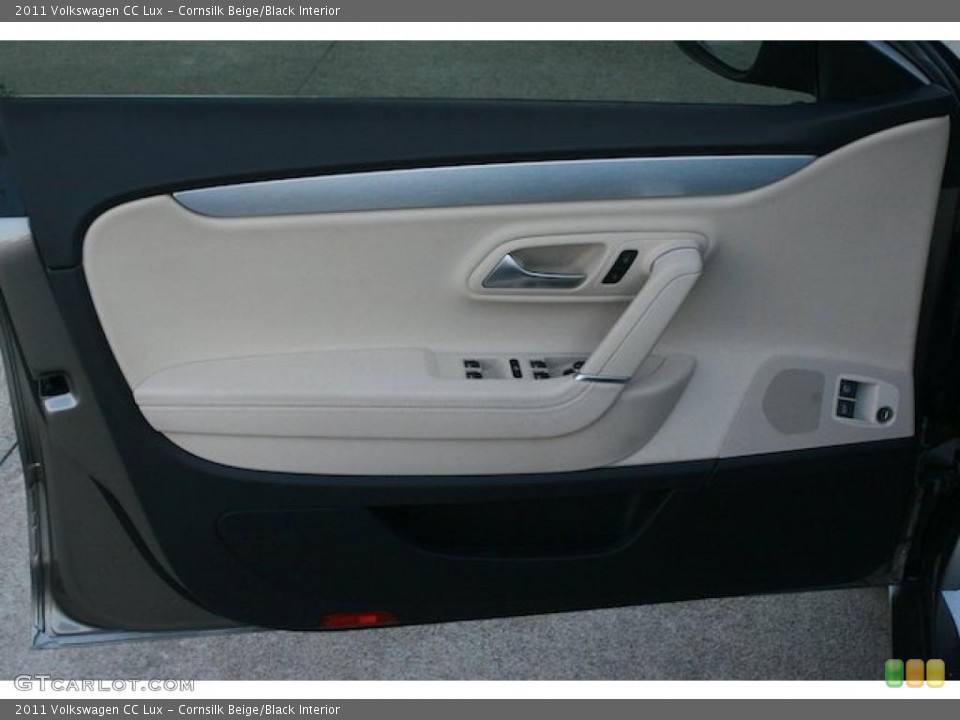 Cornsilk Beige/Black Interior Door Panel for the 2011 Volkswagen CC Lux #43541861