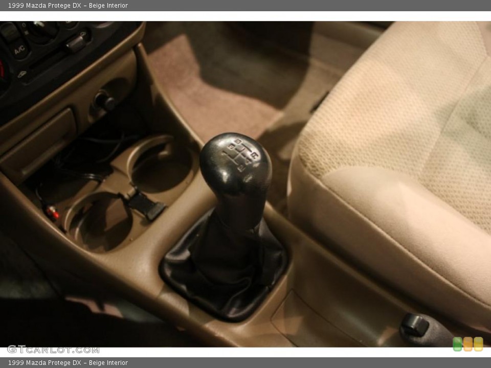 Beige Interior Transmission for the 1999 Mazda Protege DX #43873429