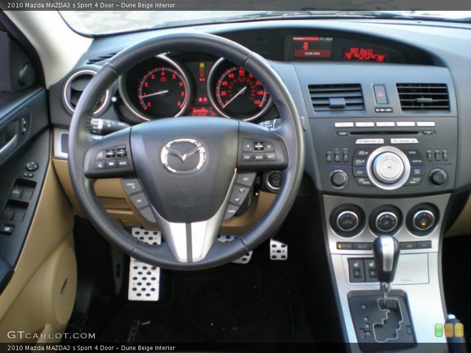 Dune Beige Interior Dashboard for the 2010 Mazda MAZDA3 s Sport 4 Door #44123298