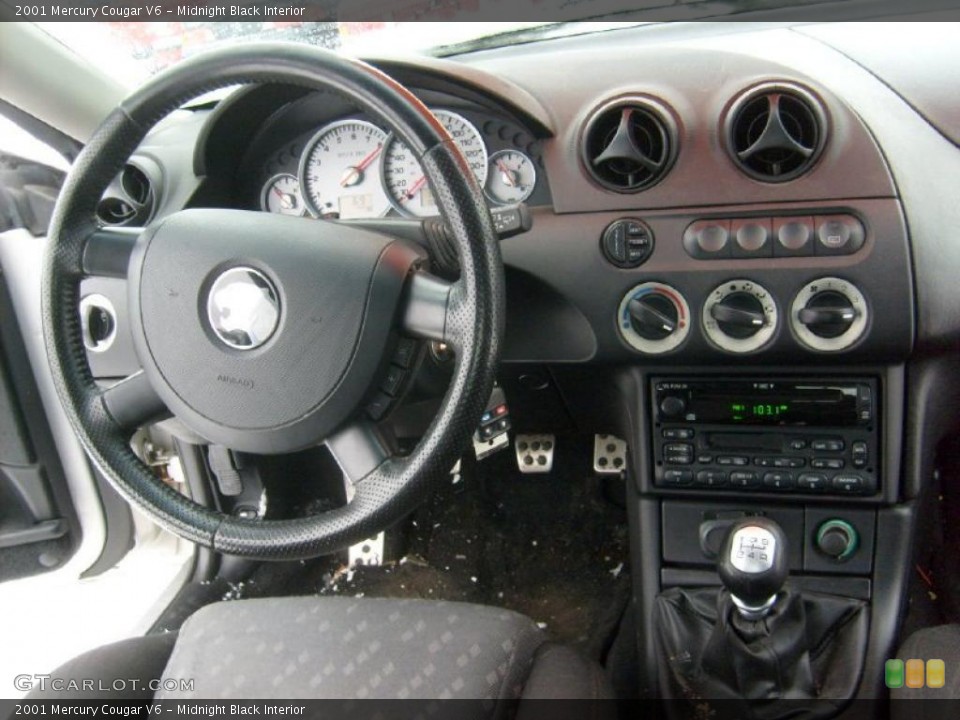 Midnight Black Interior Dashboard for the 2001 Mercury Cougar V6 #44211504