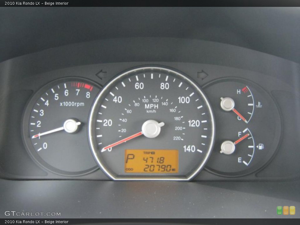 Beige Interior Gauges for the 2010 Kia Rondo LX #44602276