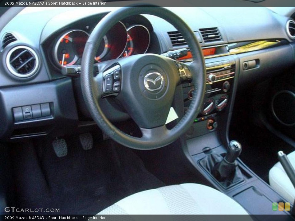 Beige Interior Dashboard for the 2009 Mazda MAZDA3 s Sport Hatchback #44697741