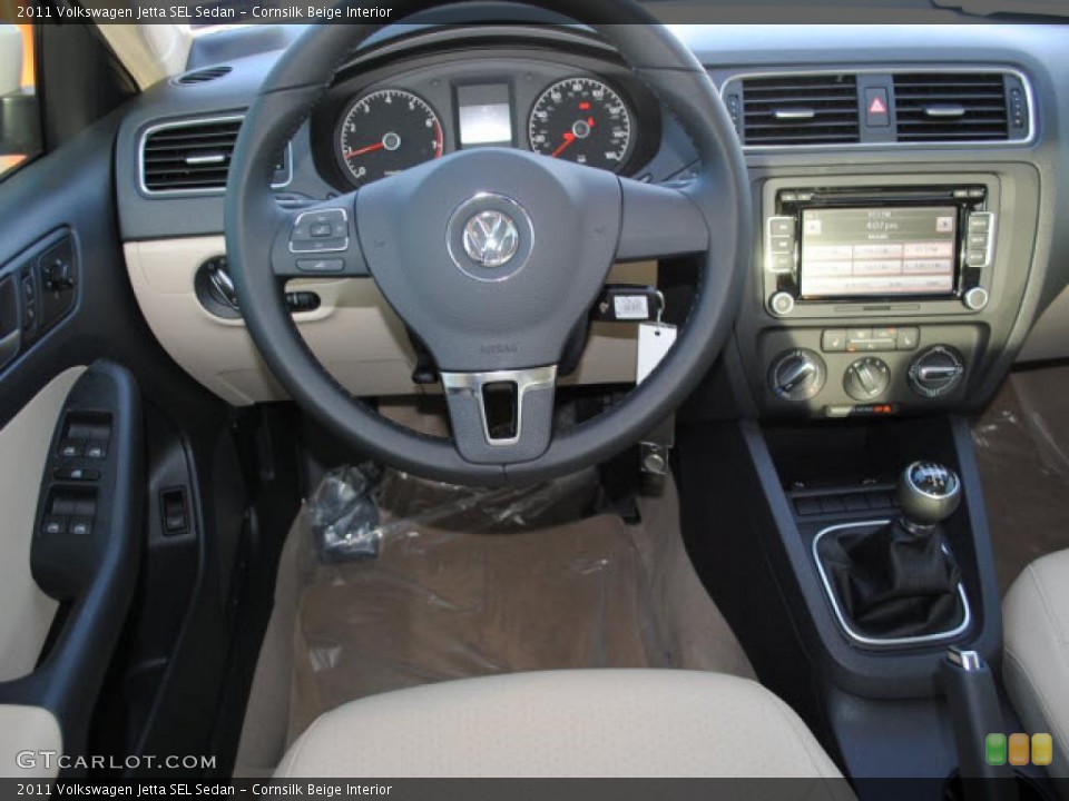 Cornsilk Beige Interior Dashboard for the 2011 Volkswagen Jetta SEL Sedan #44722572