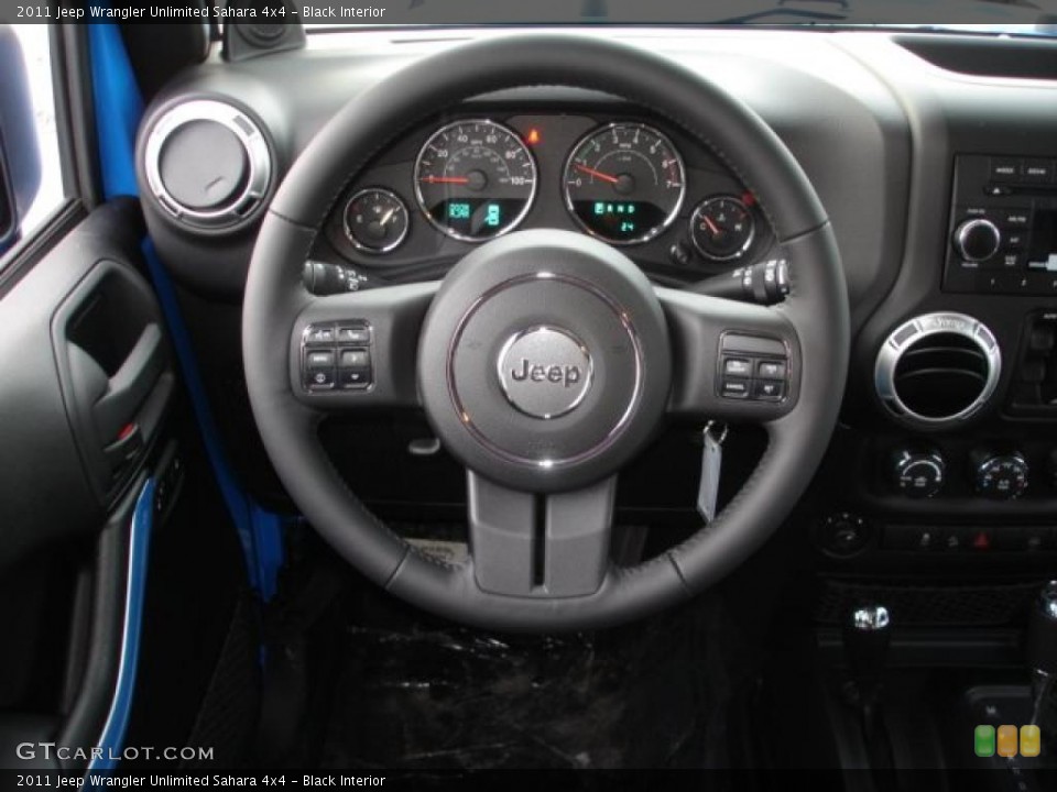 Black Interior Steering Wheel for the 2011 Jeep Wrangler Unlimited Sahara 4x4 #44823704