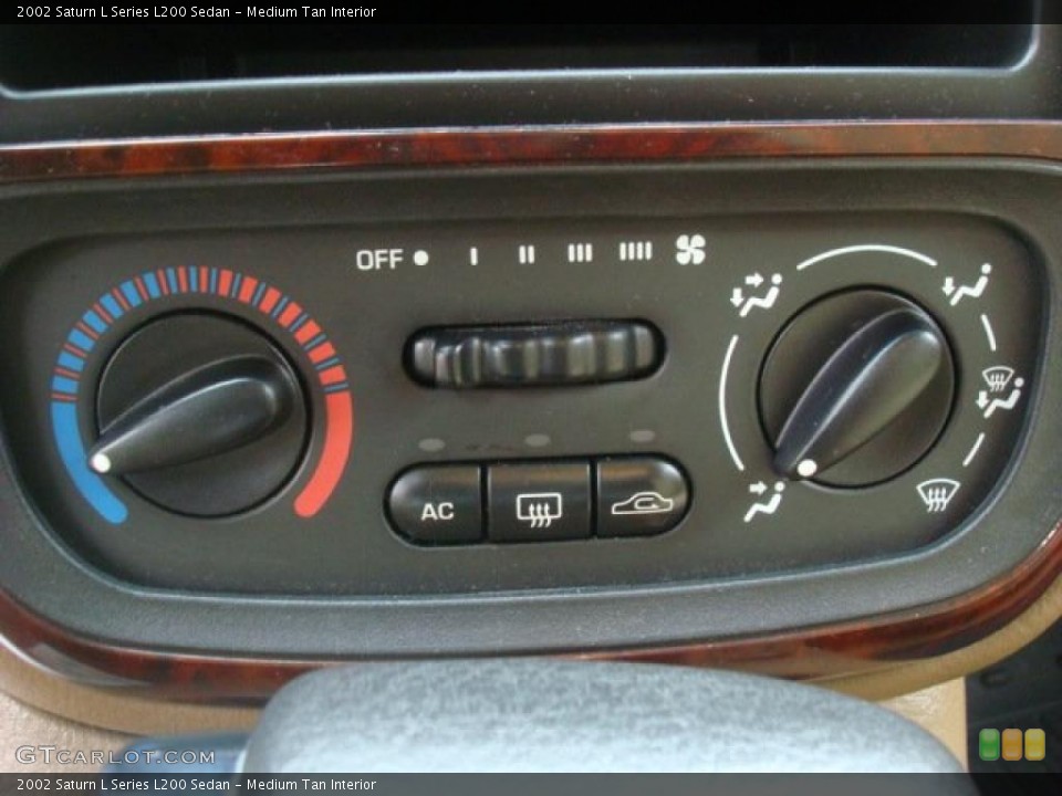 Medium Tan Interior Controls for the 2002 Saturn L Series L200 Sedan #44889282