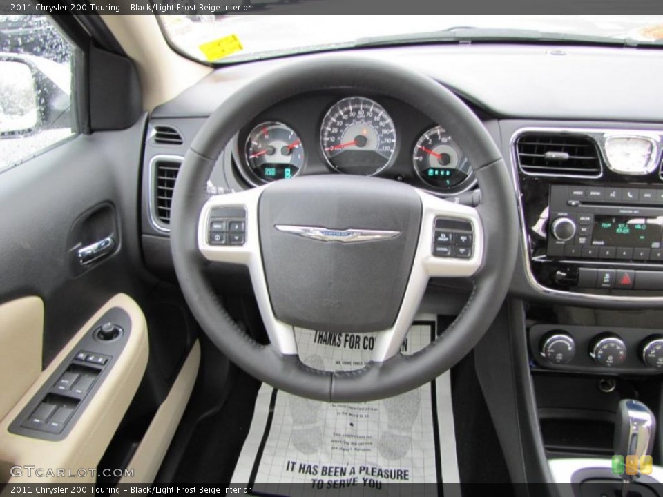 Black/Light Frost Beige Interior Steering Wheel for the 2011 Chrysler 200 Touring #44911719