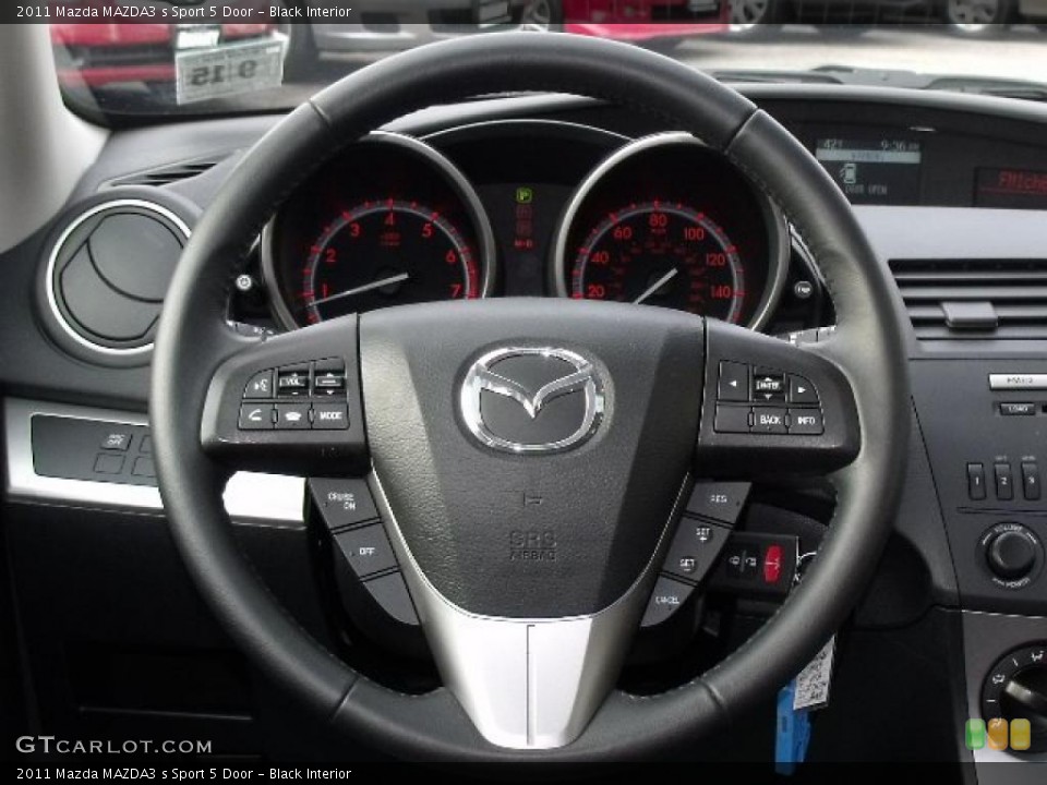 Black Interior Steering Wheel for the 2011 Mazda MAZDA3 s Sport 5 Door #44913932