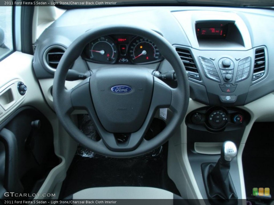 Light Stone/Charcoal Black Cloth Interior Dashboard for the 2011 Ford Fiesta S Sedan #45001606