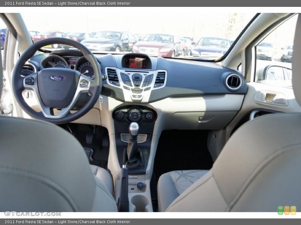 Light Stone/Charcoal Black Cloth Interior Dashboard for the 2011 Ford Fiesta SE Sedan #45114420