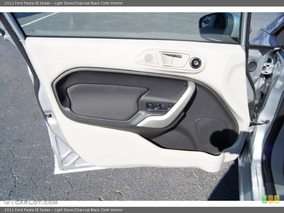 Light Stone/Charcoal Black Cloth Interior Door Panel for the 2011 Ford Fiesta SE Sedan #45114438