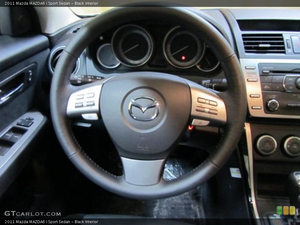 Black Interior Steering Wheel for the 2011 Mazda MAZDA6 i Sport Sedan #45233061