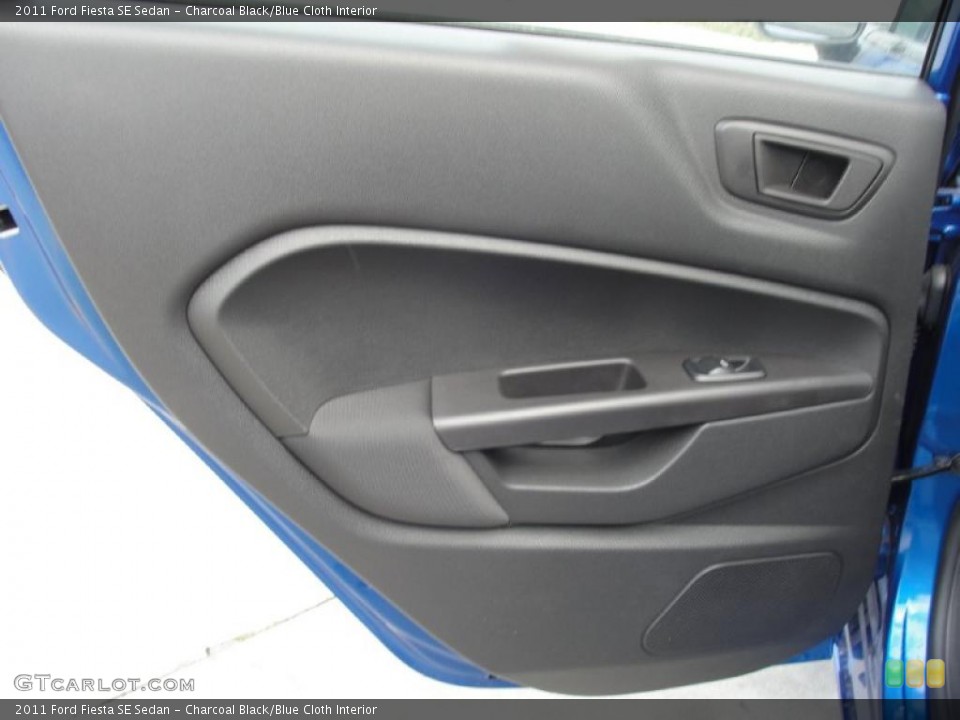Charcoal Black/Blue Cloth Interior Door Panel for the 2011 Ford Fiesta SE Sedan #45370298