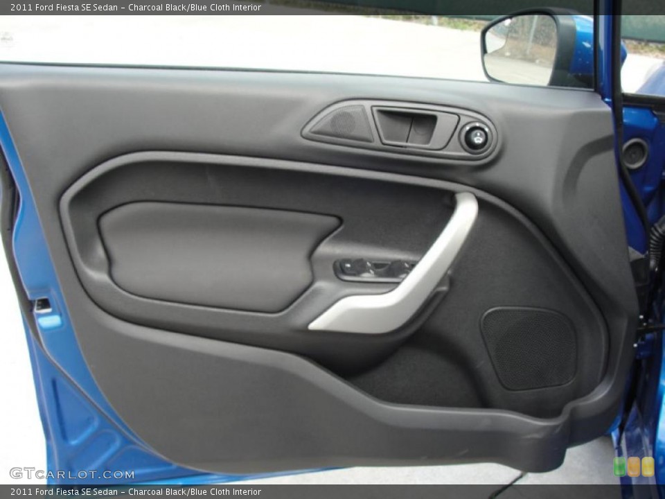 Charcoal Black/Blue Cloth Interior Door Panel for the 2011 Ford Fiesta SE Sedan #45370314
