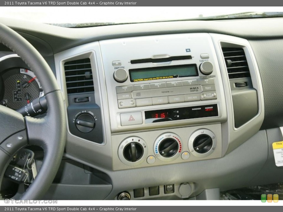 Graphite Gray Interior Controls for the 2011 Toyota Tacoma V6 TRD Sport Double Cab 4x4 #45572608