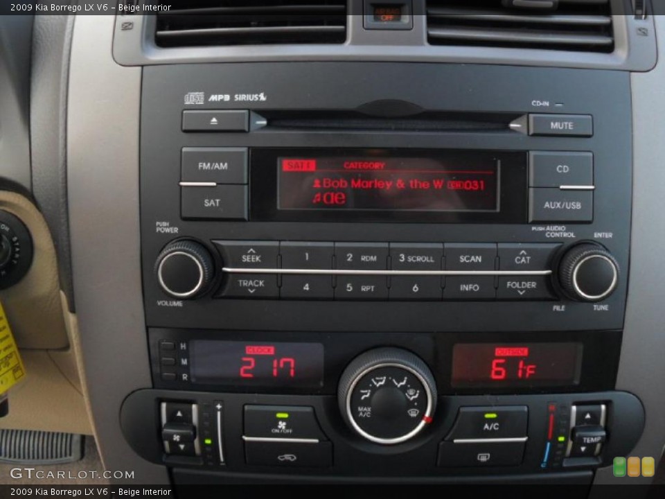 Beige Interior Controls for the 2009 Kia Borrego LX V6 #45615700