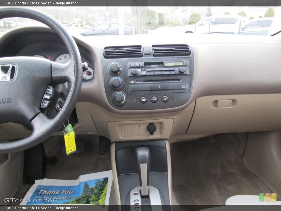 Beige Interior Dashboard for the 2002 Honda Civic LX Sedan #45674248