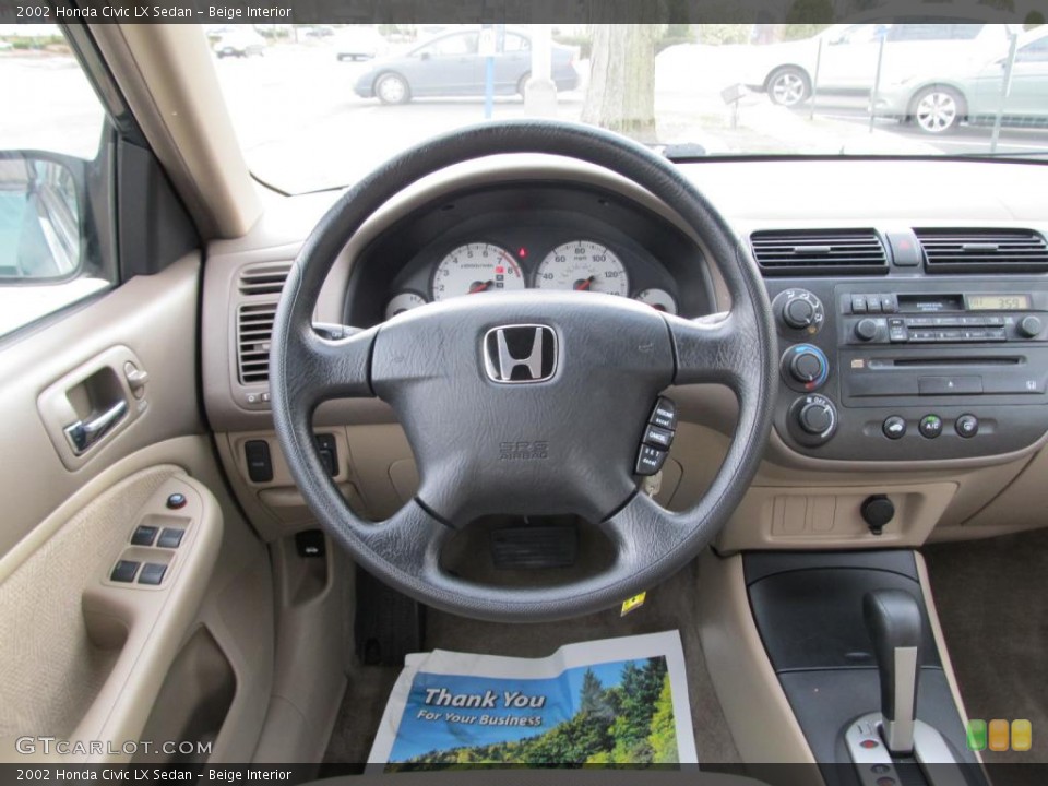 Beige Interior Dashboard for the 2002 Honda Civic LX Sedan #45674268
