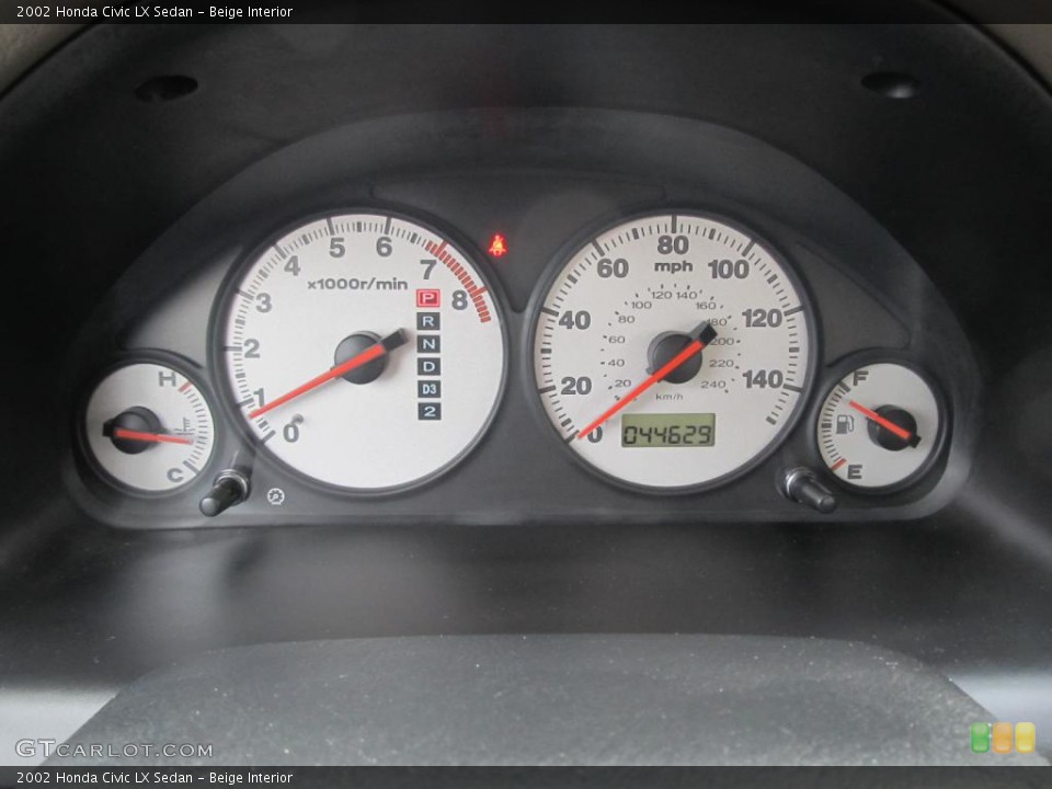 Beige Interior Gauges for the 2002 Honda Civic LX Sedan #45674284