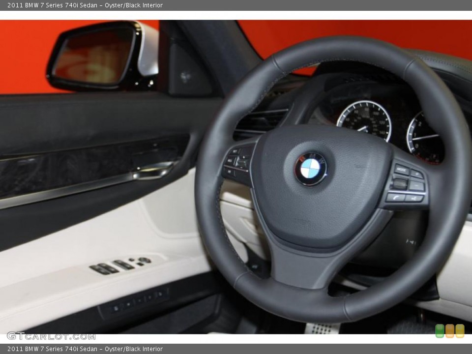 Oyster/Black Interior Steering Wheel for the 2011 BMW 7 Series 740i Sedan #45678838