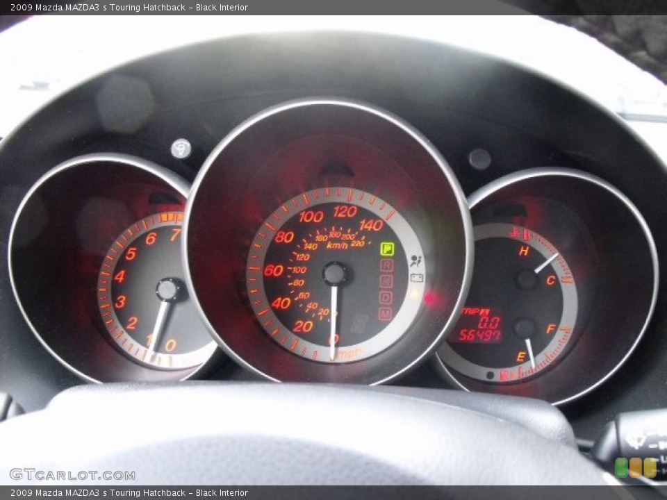 Black Interior Gauges for the 2009 Mazda MAZDA3 s Touring Hatchback #45680254