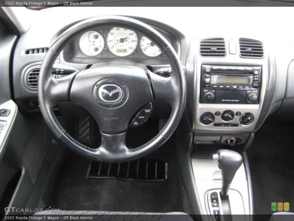 Off Black Interior Dashboard For The 2002 Mazda Protege 5