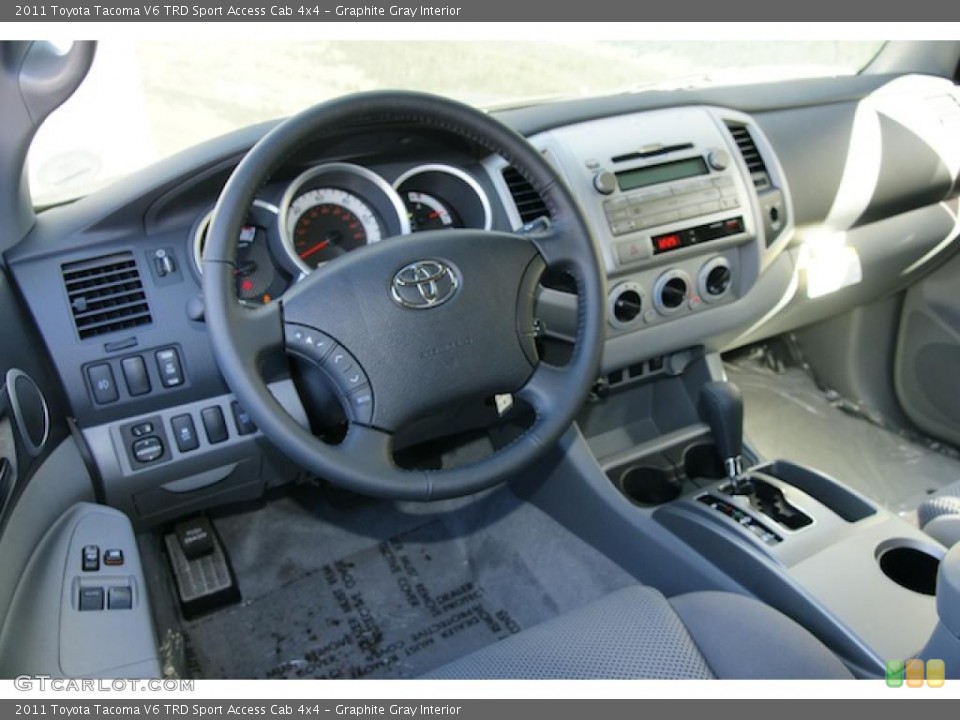Graphite Gray Interior Dashboard for the 2011 Toyota Tacoma V6 TRD Sport Access Cab 4x4 #45702697