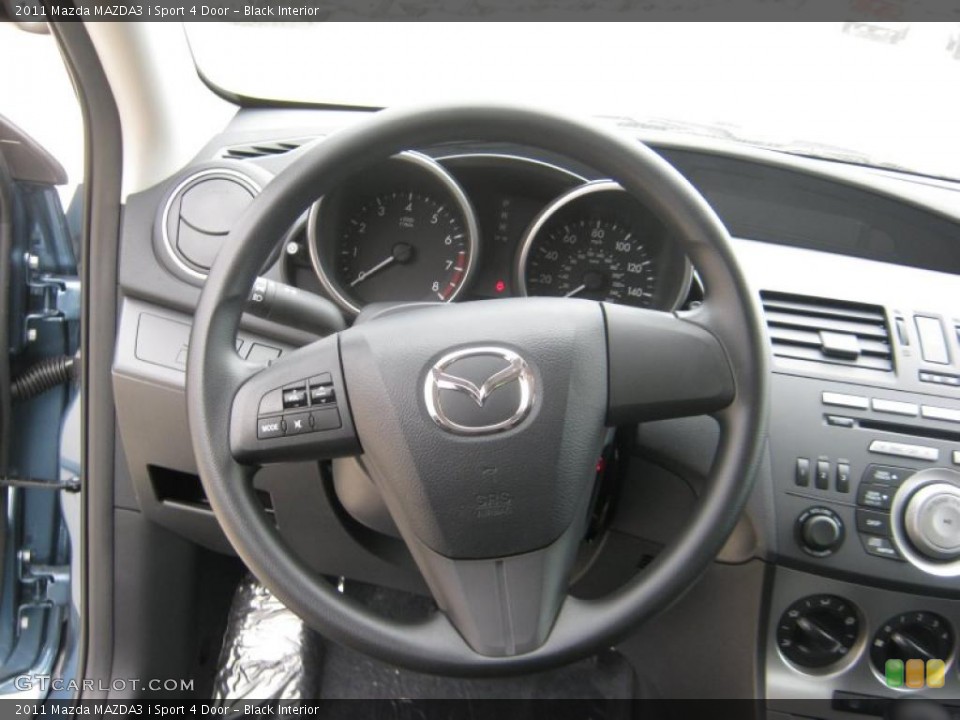 Black Interior Steering Wheel for the 2011 Mazda MAZDA3 i Sport 4 Door #45706586