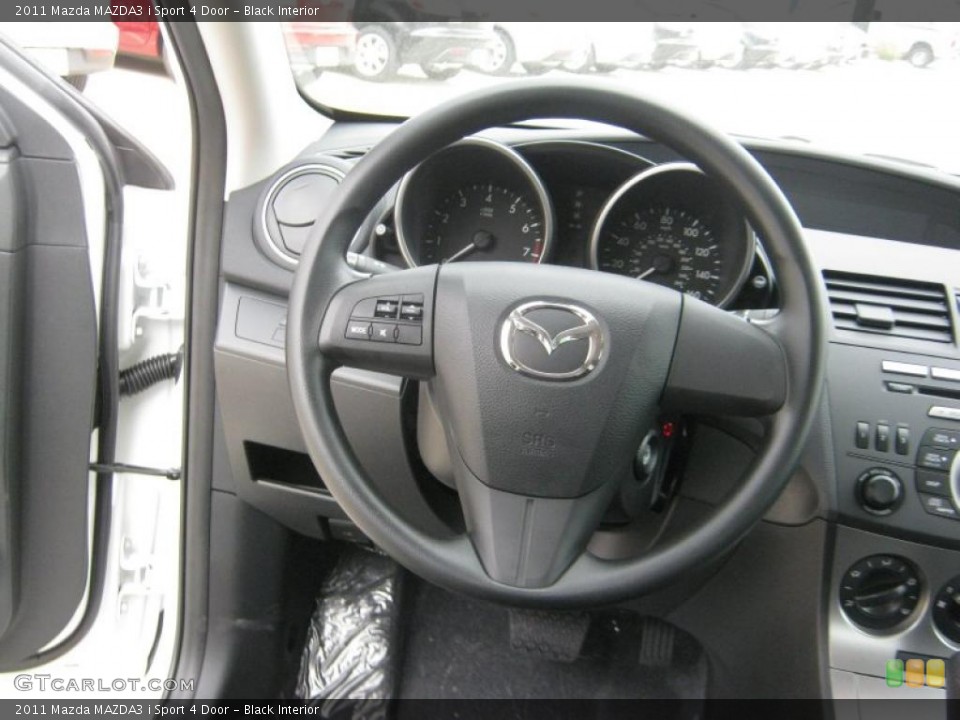 Black Interior Steering Wheel for the 2011 Mazda MAZDA3 i Sport 4 Door #45706854