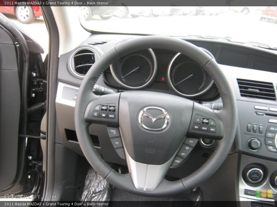 Black Interior Steering Wheel for the 2011 Mazda MAZDA3 s Grand Touring 4 Door #45707494