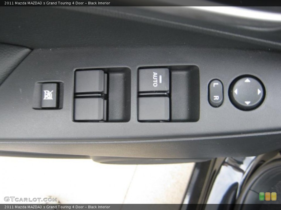 Black Interior Controls for the 2011 Mazda MAZDA3 s Grand Touring 4 Door #45707558