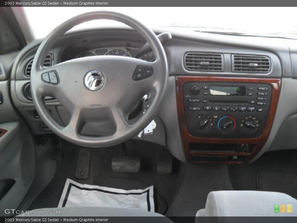 Medium Graphite Interior Dashboard for the 2003 Mercury Sable GS Sedan #45853161