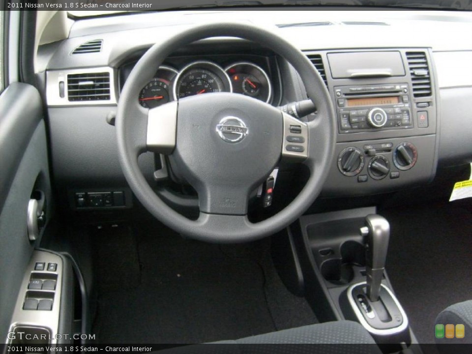Charcoal Interior Dashboard for the 2011 Nissan Versa 1.8 S Sedan #45928933