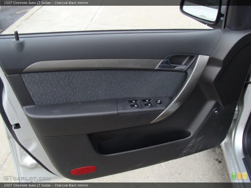 Charcoal Black Interior Door Panel for the 2007 Chevrolet Aveo LT Sedan #45932382