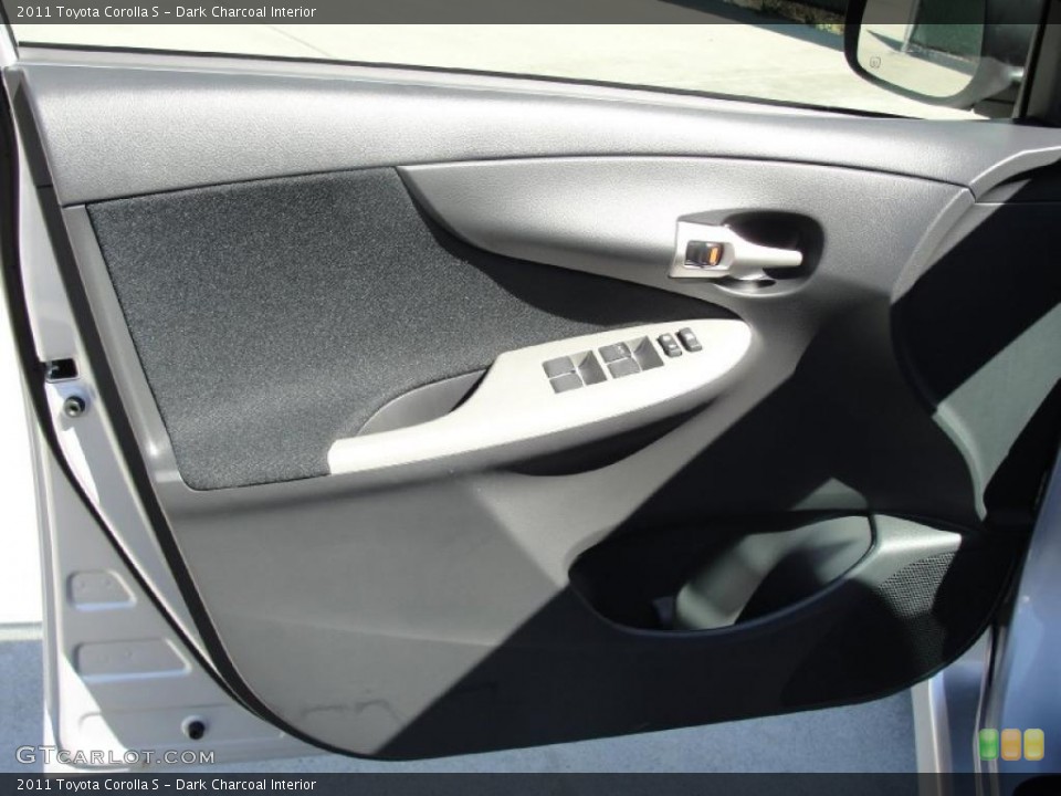 Dark Charcoal Interior Door Panel for the 2011 Toyota Corolla S #45964418