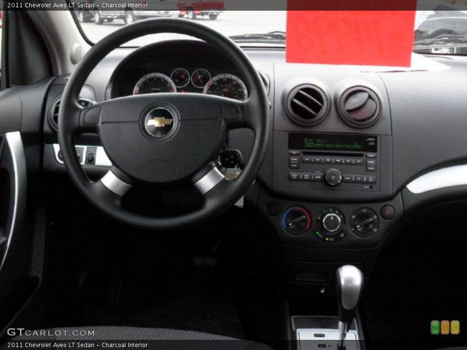 Charcoal Interior Dashboard for the 2011 Chevrolet Aveo LT Sedan #46062516