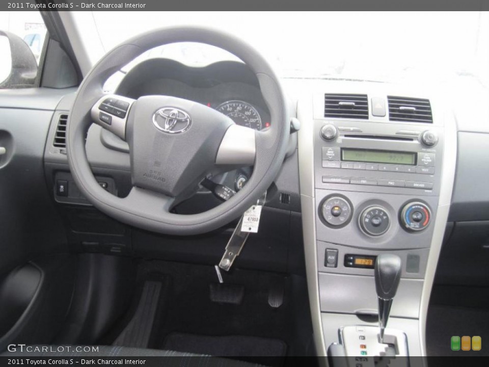 Dark Charcoal Interior Dashboard for the 2011 Toyota Corolla S #46093190